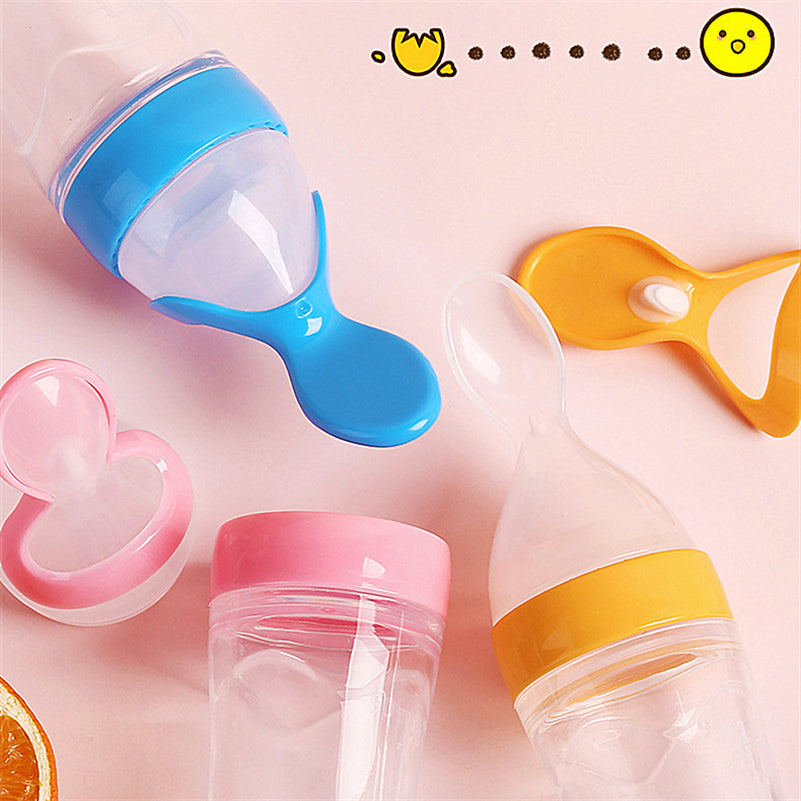 Baby bottle with small spoon